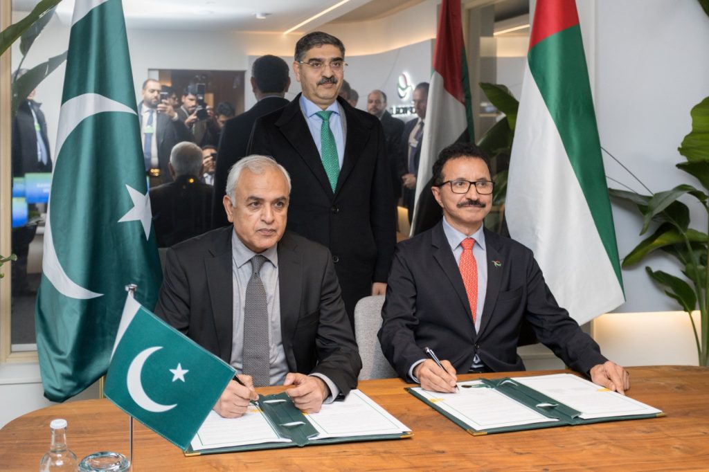 H.E. Shahid Ashraf Tarar, Pakistan’s Federal Minister of Communication, Railways and Maritime Affairs, and Sultan Ahmed bin Sulayem, Chairman of Ports, Customs and Free Zone Corporation (PCFC), Government of Dubai, signing the agreements at Davos, as HE Pakistan's Prime Minister Anwar-ul-Haq Kakar, looks on.