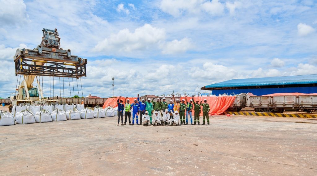Workers celebrating the first loading of Kamoa-Kakula’s copper concentrate at the Impala Terminals warehouse, Kolwezi. The concentrate was bagged into 2-tonne bags at Kamoa-Kakula and trucked 50 kilometres to the Impala Terminals warehouse before loading.