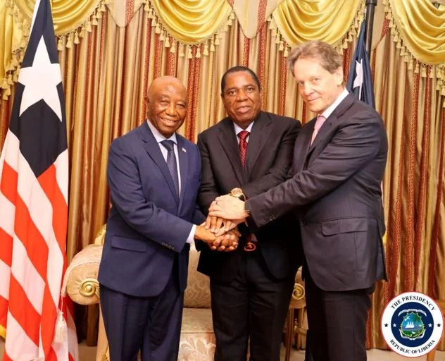The President of Liberia His Excellency Joseph Nyuma Boakai Sr with Mr Robert Friedland and Mr Robert Gumede at the signing ceremony in Monrovia on Friday 9 February 2024.